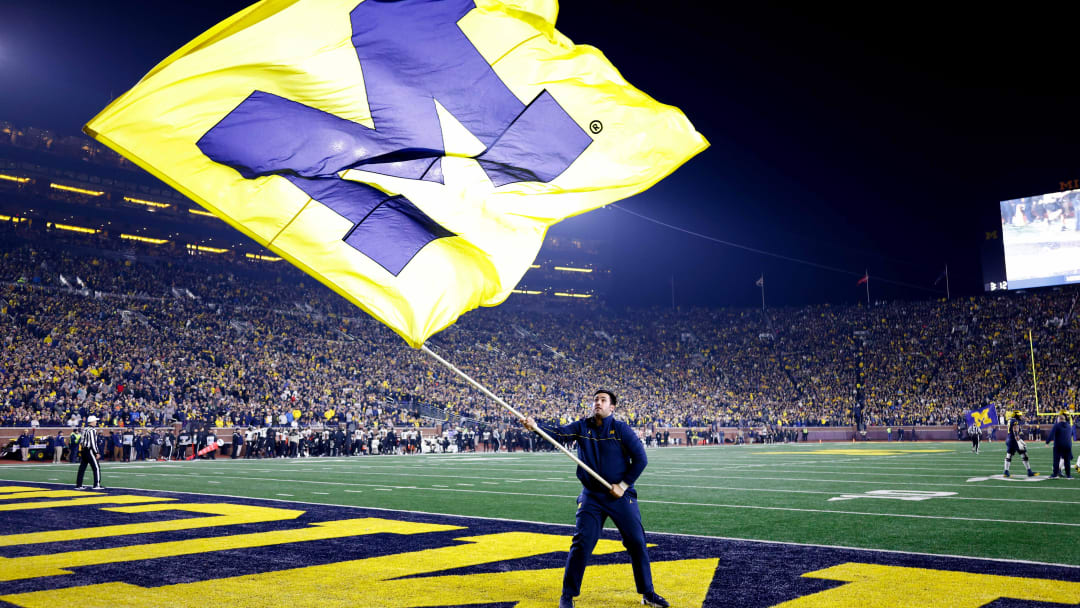 Nov 4, 2023; Ann Arbor, Michigan, USA;  Michigan Wolverines cheerleader celebrates after a touchdown in the second half against the Purdue Boilermakers at Michigan Stadium. Mandatory Credit: Rick Osentoski-USA TODAY Sports