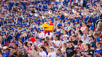 Sep 28, 2024; Kansas City, Missouri, USA; The Kansas Jayhawks mascot sits among the marching band during the second half of the game against the TCU Horned Frogs at GEHA Field at Arrowhead Stadium. Mandatory Credit: Denny Medley-Imagn Images