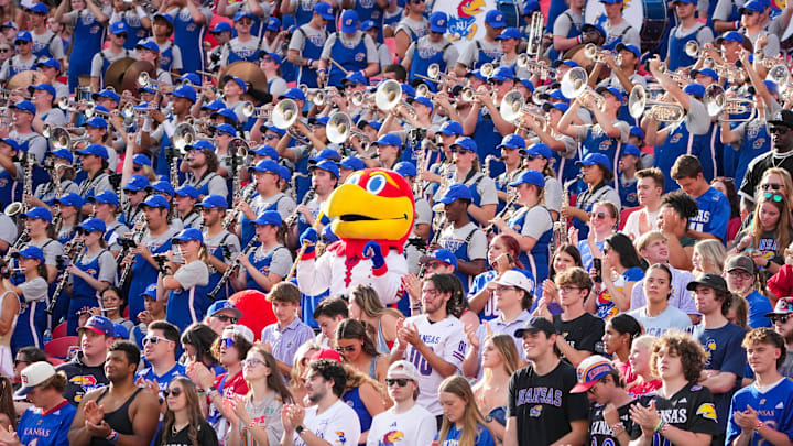 Sep 28, 2024; Kansas City, Missouri, USA; The Kansas Jayhawks mascot sits among the marching band during the second half of the game against the TCU Horned Frogs at GEHA Field at Arrowhead Stadium. Mandatory Credit: Denny Medley-Imagn Images