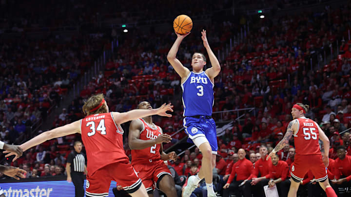 Jan 18, 2025; Salt Lake City, Utah, USA; Brigham Young Cougars guard Egor Demin (3) shoots over Utah Utes forward Ezra Ausar (2) during the second half at Jon M. Huntsman Center. Mandatory Credit: Rob Gray-Imagn Images