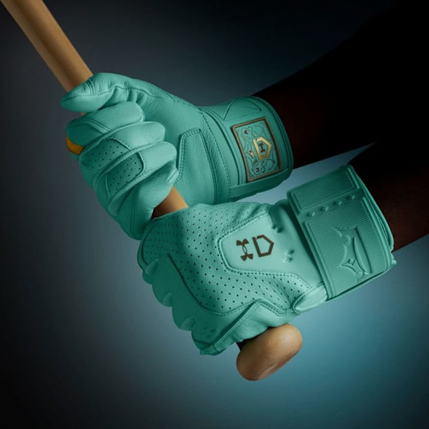 Teal Under Armour batting gloves.