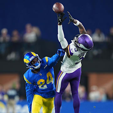 Jan 13, 2025; Glendale, AZ, USA; Minnesota Vikings wide receiver Jordan Addison (3) attempts to make a catch against Los Angeles Rams cornerback Darious Williams (24) during the second half in an NFC wild card game at State Farm Stadium. 