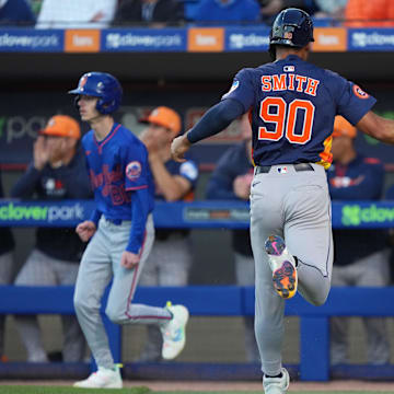 Mar 6, 2025; Port St. Lucie, Florida, USA;  Houston Astros infielder Cam Smith (90) celebrates scoring a run with teammate Chas McCormick, right, in the first inning against the New York Mets at Clover Park. Mandatory Credit: Jim Rassol-Imagn Images