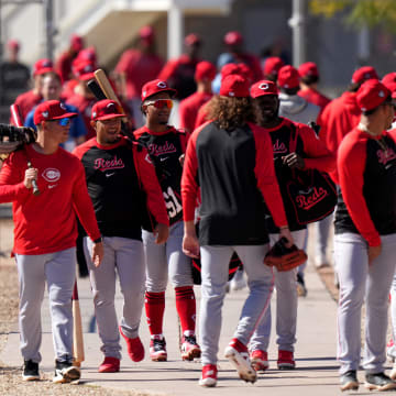 Cincinnati Reds players on both the minor and major league rosters switch fields during spring training workouts, Monday, Feb. 19, 2024, at the team's spring training facility in Goodyear, Ariz.