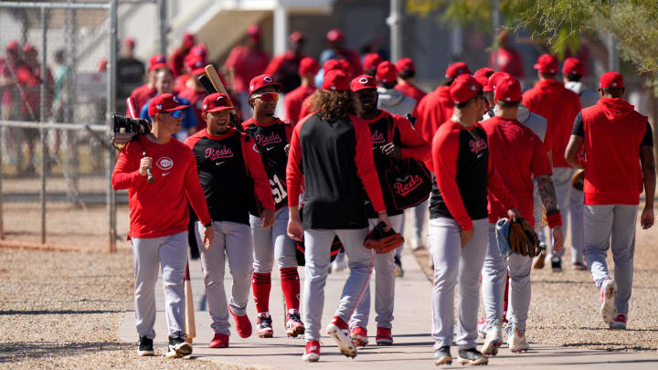 Cincinnati Reds players on both the minor and major league rosters switch fields during spring training workouts, Monday, Feb. 19, 2024, at the team's spring training facility in Goodyear, Ariz.