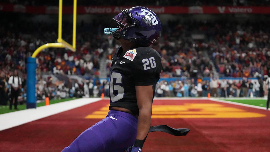 Dec 30, 2025; San Antonio, TX, USA; TCU Horned Frogs running back Jeremy Payne (26) scores on a 35-yard touchdown reception in overtime for the winning score against the Southern California Trojans during the Alamo Bowl at Alamodome. Mandatory Credit: Kirby Lee-Imagn Images