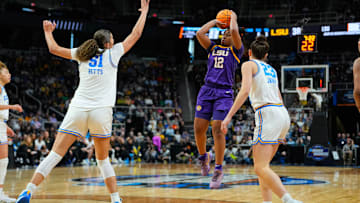 LSU Tigers guard Mikaylah Williams shoots a jump shot against UCLA Bruins center Lauren Betts and forward Gabriela Jaquez.
