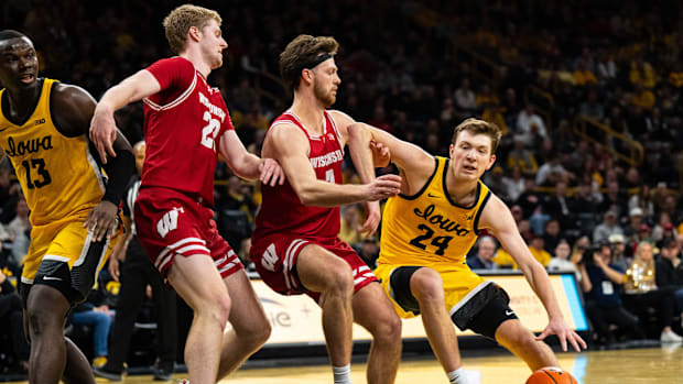 Feb 8, 2025; Iowa City, Iowa, USA; Iowa Hawkeyes forward Pryce Sandfort (24) drives against Wisconsin Badgers forward Carter 