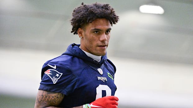Jun 10, 2025; Foxborough, MA, USA; New England Patriots cornerback Christian Gonzalez (0) jogs to the sideline during minicam