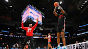 Mar 20, 2025; Seattle, WA, USA; Maryland Terrapins guard Selton Miguel (9) shoots the ball over assistant coach Kevin Norris during practice at Climate Pledge Arena. Mandatory Credit: Steven Bisig-Imagn Images