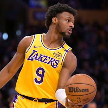 Mar 19, 2025; Los Angeles, California, USA;  Los Angeles Lakers guard Bronny James (9) inbound the ball in the second half against the Denver Nuggets at Crypto.com Arena. Mandatory Credit: Jayne Kamin-Oncea-Imagn Images