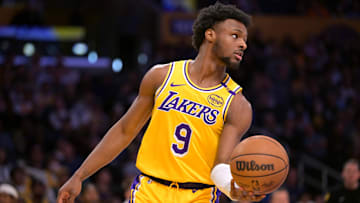 Mar 19, 2025; Los Angeles, California, USA;  Los Angeles Lakers guard Bronny James (9) inbound the ball in the second half against the Denver Nuggets at Crypto.com Arena. Mandatory Credit: Jayne Kamin-Oncea-Imagn Images