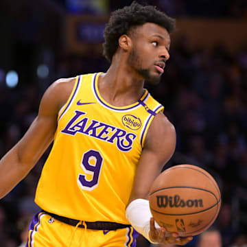 Mar 19, 2025; Los Angeles, California, USA;  Los Angeles Lakers guard Bronny James (9) inbound the ball in the second half against the Denver Nuggets at Crypto.com Arena. Mandatory Credit: Jayne Kamin-Oncea-Imagn Images