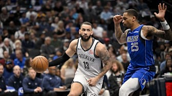 Mar 31, 2025; Dallas, Texas, USA; Brooklyn Nets guard Tyrese Martin (13) and Dallas Mavericks forward P.J. Washington (25) in action during the game between the Dallas Mavericks and the Brooklyn Nets at the American Airlines Center. Mandatory Credit: Jerome Miron-Imagn Images