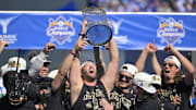 Nov 1, 2024; Los Angeles, CA, USA;  Los Angeles Dodgers starting pitcher Clayton Kershaw (22) lifts the World Series Championship Trophy during the team celebration at Dodger Stadium. 