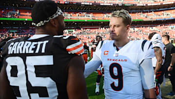 Oct 20, 2024; Cleveland, Ohio, USA; Cincinnati Bengals quarterback Joe Burrow (9) and Cleveland Browns defensive end Myles Garrett (95) talk after the game at Huntington Bank Field. Mandatory Credit: Ken Blaze-Imagn Images