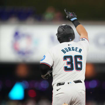 Miami Marlins designated hitter Jake Burger (36) rounds the bases after hitting his second home run of the game in the fifth inning against the Cincinnati Reds at loanDepot Park on Aug 7.