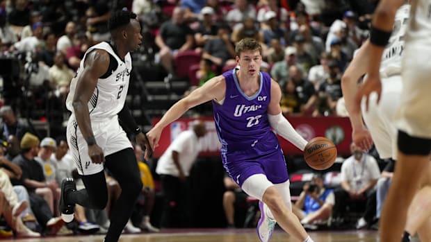 Jul 14, 2025; Las Vegas, NV, USA;  Utah Jazz forward Kyle Filipowski (22) dribbles the ball against San Antonio Spurs forward