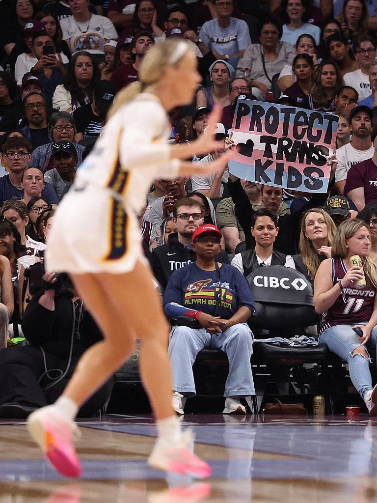 A fan holds up a 