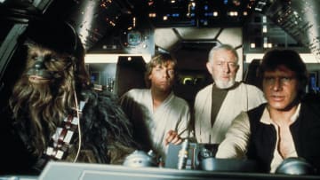 "Chewbacca, Luke Skywalker (Mark Hamill), Ben (Obi-Wan) Kenobi (Alec Guinness), and Han Solo (Harrison Ford) in the Millennium Falcon. ? Lucasfilm Ltd. & TM. All Rights Reserved."