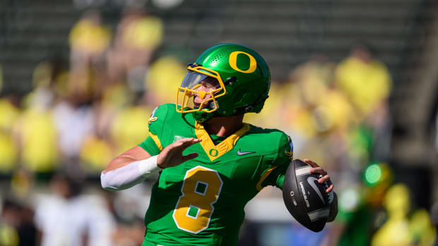 Aug 31, 2024; Eugene, Oregon, USA; Oregon Ducks quarterback Dillon Gabriel (8) throws a pass warming up before the game again