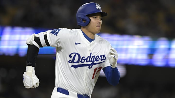 Los Angeles Dodgers designated hitter Ohtani runs to first base. Los Angeles Dodgers designated hitter Ohtani runs to first base.