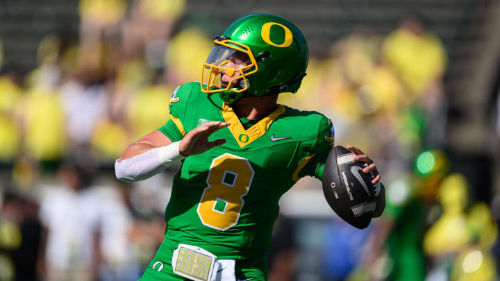 Aug 31, 2024; Eugene, Oregon, USA; Oregon Ducks quarterback Dillon Gabriel (8) throws a pass warming up before the game against the Idaho Vandals at Autzen Stadium. 