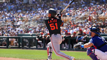 Mar 1, 2025; Phoenix, Arizona, USA; San Francisco Giants outfielder Jung Hoo Lee (51) hits against the Los Angeles Dodgers during the first inning at Camelback Ranch-Glendale. 