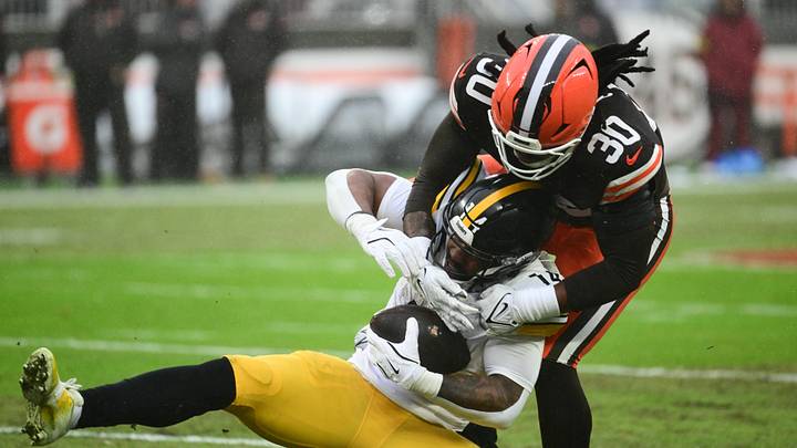 Dec 28, 2025; Cleveland, Ohio, USA; Cleveland Browns linebacker Devin Bush (30) tackles Pittsburgh Steelers running back Kenneth Gainwell (14) in the first quarter at Huntington Bank Field. Mandatory Credit: Ken Blaze-Imagn Images