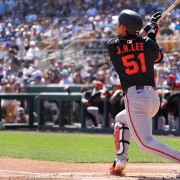 Mar 1, 2025; Phoenix, Arizona, USA; San Francisco Giants outfielder Jung Hoo Lee (51) hits against the Los Angeles Dodgers during the first inning at Camelback Ranch-Glendale. 