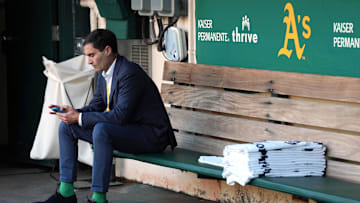 Sep 23, 2022; Oakland, California, USA; Oakland Athletics president Dave Kaval sits in the dugout before the game against the New York Mets at RingCentral Coliseum. Mandatory Credit: Darren Yamashita-Imagn Images