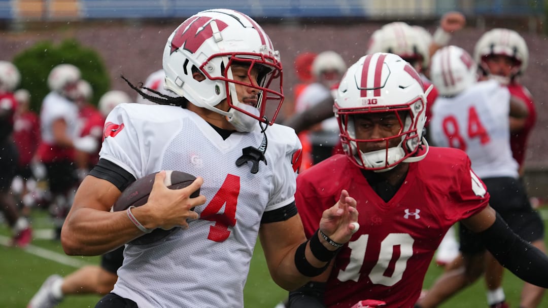 Wisconsin wide receiver Jayden Ballard (4) heads for the corner during football practice, July 30, 2025, at Ralph E. Davis Pioneer Stadium in Platteville, Wisconsin.