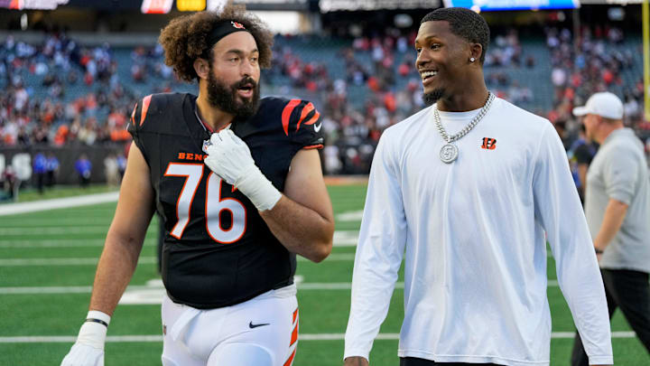 Injured Cincinnati Bengals wide receiver Tee Higgins (5) heads for the locker room with offensive tackle Devin Cochran (76) after the fourth quarter of the NFL Week 9 game between the Cincinnati Bengals and the Las Vegas Raiders at Paycor Stadium in downtown Cincinnati on Sunday, Nov. 3, 2024. The Bengals collected their first win at home with a 41-24 victory over the Raiders.