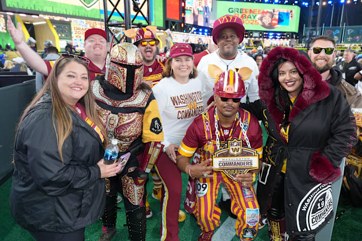 Washington Commanders fans cheer before the first round of the 2025 NFL Draft at Lambeau Field. 