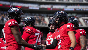 Oct 11, 2025; Cincinnati, Ohio, USA; Cincinnati Bearcats quarterback Brendan Sorsby (2) celebrates a touchdown with wide receiver Jeff Caldwell (9) against the UCF Knights in the first half at Nippert Stadium. Mandatory Credit: Aaron Doster-Imagn Images