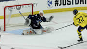 Aug 3, 2024; Plymouth, MI, USA; Finland's goaltender Kim Saarinen (31) makes a glove save on a break away shot from Sweden's forward Isac Hedqvist (22) during the second period of the 2024 World Junior Summer Showcase at USA Hockey Arena. Mandatory Credit: David Reginek-Imagn Images