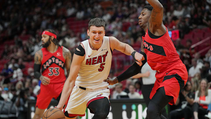 Apr 12, 2024; Miami, Florida, USA; Miami Heat forward Nikola Jovic (5) drives past Toronto Raptors - Jim Rassol/USA Today Sports Apr 12, 2024; Miami, Florida, USA; Miami Heat forward Nikola Jovic (5) drives past Toronto Raptors - Jim Rassol/USA Today Sports