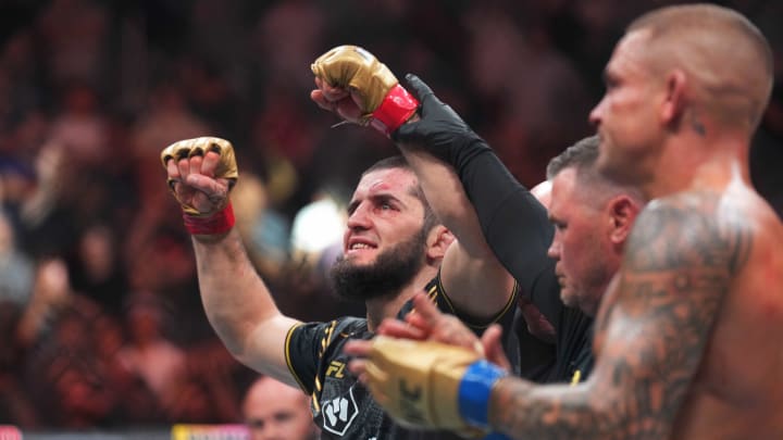 Jun 1, 2024; Newark, New Jersey, USA; Islam Makhachev (red gloves) celebrates defeating Dustin Poirier (blue gloves) during UFC 302 at Prudential Center. Mandatory Credit: Joe Camporeale-USA TODAY Sports