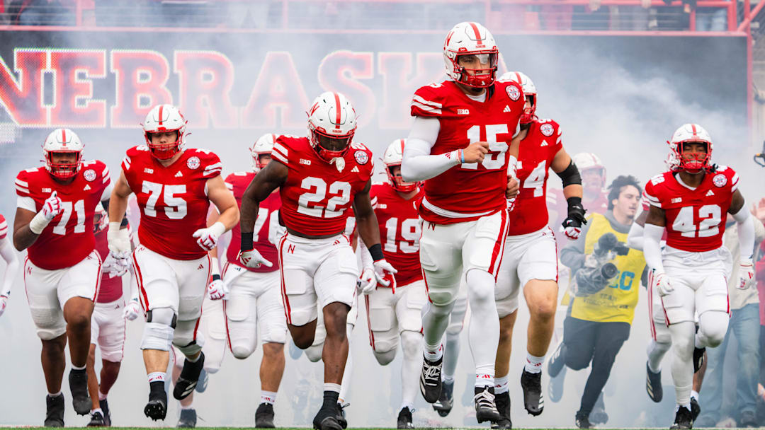Nov 2, 2024; Lincoln, Nebraska, USA; The Nebraska Cornhuskers run onto the field before a game against the UCLA Bruins at Memorial Stadium. Mandatory Credit: Dylan Widger-Imagn Images