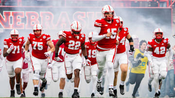 Nov 2, 2024; Lincoln, Nebraska, USA; The Nebraska Cornhuskers run onto the field before a game against the UCLA Bruins at Memorial Stadium. Mandatory Credit: Dylan Widger-Imagn Images