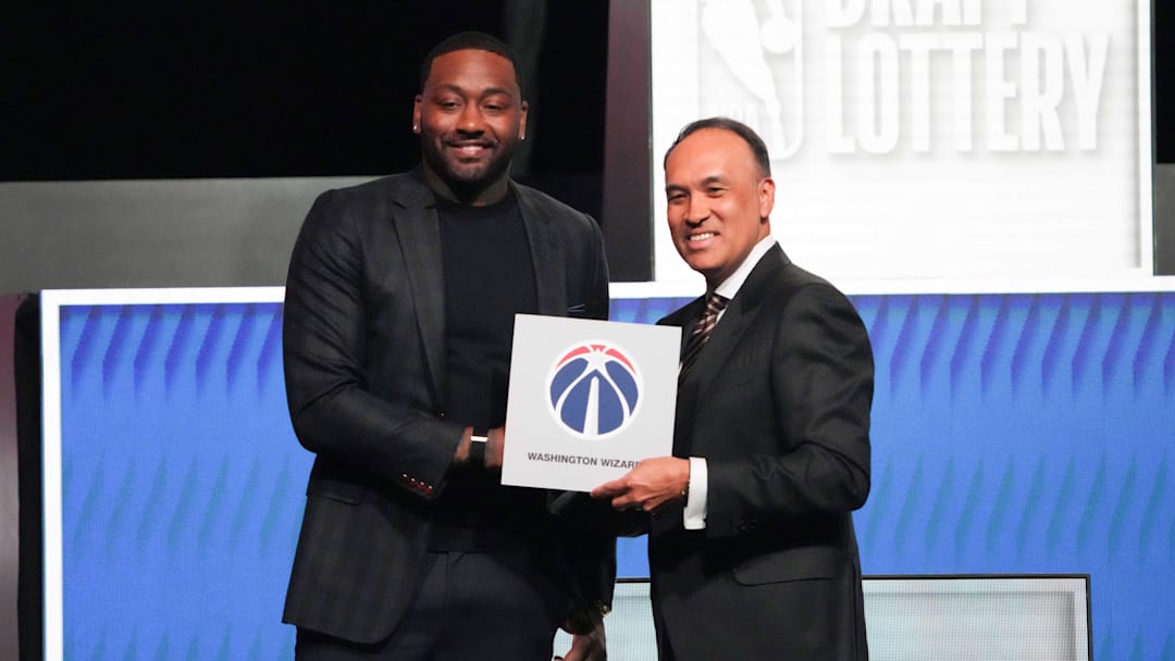 May 10, 2026; Chicago, IL, USA; Mark Tatum the NBA Deputy Commissioner and Washington Wizard (left) guard John Wall pose for photos after Wizards won the 2026 NBA Draft Lottery at Navy Pier. Mandatory Credit: David Banks-Imagn Images