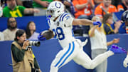 Indianapolis Colts running back Jonathan Taylor (28) rushes with the ball Sunday, Sept. 14, 2025, during a game against the Denver Broncos at Lucas Oil Stadium in Indianapolis.
