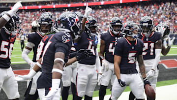 Houston, Texas, USA; Houston Texans safety Jalen Pitre (5) celebrates his interception with teammates against the Indianapolis Colts in the second quarter at NRG Stadium.