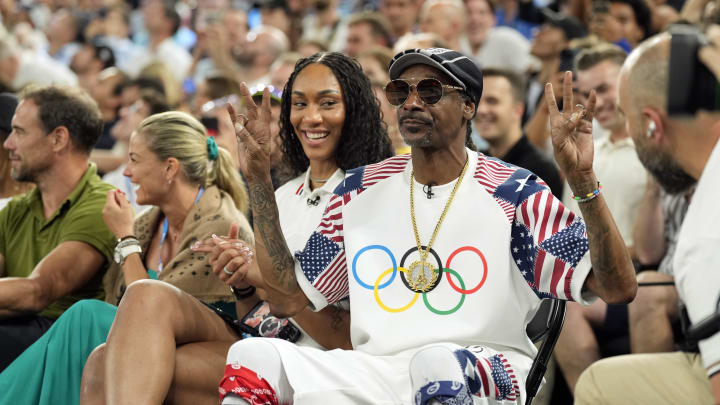 Aug 6, 2024; Paris, France; Snoop Dogg and United States women’s basketball player A’ja Wilson look on in the first half between the United States and Brazil in a men’s basketball quarterfinal game during the Paris 2024 Olympic Summer Games at Accor Arena. Mandatory Credit: Kyle Terada-USA TODAY Sports