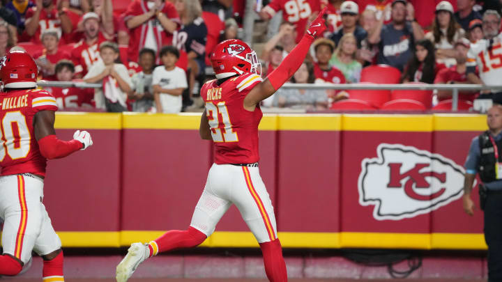 Aug 22, 2024; Kansas City, Missouri, USA; Kansas City Chiefs safety Jaden Hicks (21) celebrates against the Chicago Bears after recovering a fumble during the first half at GEHA Field at Arrowhead Stadium. Mandatory Credit: Denny Medley-USA TODAY Sports