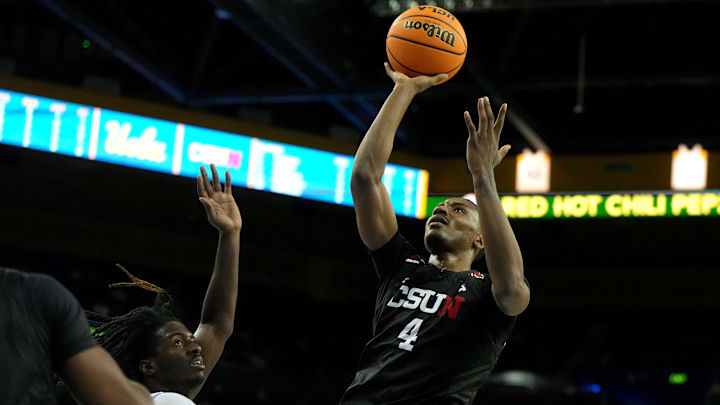 Dec 19, 2023; Los Angeles, California, USA; Cal State Northridge Matadors guard Keonte Jones (4) shoots the ball against the UCLA Bruins in the first half at Pauley Pavilion presented by Wescom. Mandatory Credit: Kirby Lee-Imagn Images
