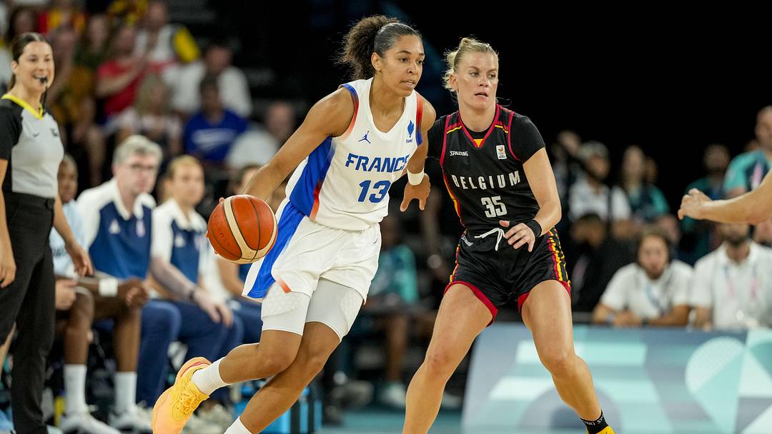 Aug 9, 2024; Paris, France; France forward Janelle Salaun (13) and Belgium point guard Julie Vanloo (35) battle for the ball in a women's basketball semifinal game during the Paris 2024 Olympic Summer Games at Accor Arena. Mandatory Credit: Kyle Terada-Imagn Images