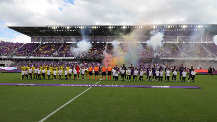 Oct 9, 2022; Orlando, Florida, USA; Columbus Crew SC and Orlando City SC players stand for the