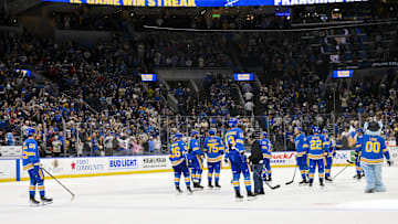 Apr 5, 2025; St. Louis, Missouri, USA;  St. Louis Blues salute their fans and celebrate after the Blues won their franchise record 12th straight win after a victory over the Colorado Avalanche at Enterprise Center. Mandatory Credit: Jeff Curry-Imagn Images