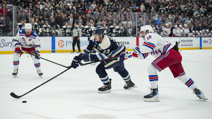 Blue Jackets center Sean Monahan gets hooked by Rangers forward Vincent Trocheck as he tries to make a play in overtime. There was no penalty called on the play.